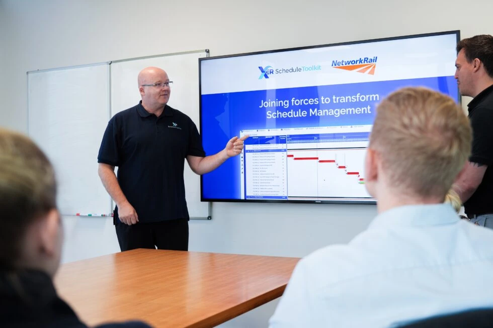 Chris Grosvenor and Matthew Tomlinson delivering a presentation about the XER Schedule Toolkit to staff at network rail