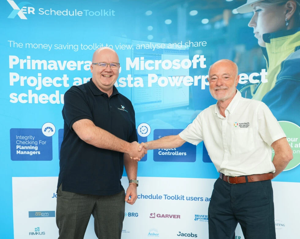 Chris Grsvenor and Tolis Chatzisymeon shaking hands in front of a XER schedule toolkit marketing banner